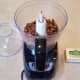 Start by blending up your almonds in the food processor.