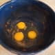 Crack your eggs into a large mixing bowl. (My bowl was just used for making pumpkin spice banana bread. The ingredients were so alike I didn't think it was necessary to wash the bowl out.)