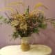 Use dried grasses, weeds, seed pods, rose hips and evergreen shrubbery to make a bouquet.