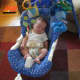 My son with our first Fisher Price swing.