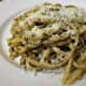 Plate the pesto-coated linguine and sprinkle with the Pecorino Romano cheese