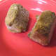 Two cubes of pesto taken from the freezer to thaw and use in this recipe