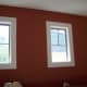 A light colored border is painted around these windows. The light color makes the window look larger.