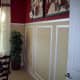 In this room, the chair rail is higher than the traditional 3 feet. There is also decorative trim work below the chair rail that adds depth to the room's decor.