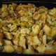 Mix together toasted bread cubes, cooked sausage, herbs and chestnuts in a 13 by 9 inch pan. Pour on the turkey broth and mix around.