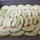 Place the sliced apples over the graham cracker mixture