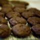 Once the cookies are cooled, reheat the reserved melted chocolate at 10 second intervals until melted.