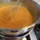 Cook the egg yolks, pumpkin, milk, cinnamon, and salt in a double boiler until thick; then set aside to cool.