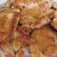 A plate of browned chicken thighs