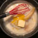 Add the egg yolks and continue to stir until all ingredients are well mixed and warm.