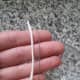 Cut short lengths of cotton string and metal craft wire.