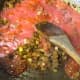 Add the ginger garlic paste and tomato sauce in with the onions.