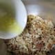 Pour the melted butter into the Herb Seasoned Stuffing mix