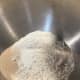 In a stand mixer bowl fitted with a dough hook, combine the bread flour, all-purpose flour, milk powder, sugar, yeast, and salt.
