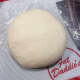 Knead the dough until it forms a smooth ball. Use a dough scraper to help and scrape the excess dough on the mat. 