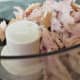 Place the bits of fish into a food processor