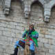 An Italian firefighter dressed as La Befana in Gubbio.