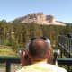 Our son Michael viewing Crazy Horse using a coin operated view finder