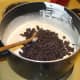 Add the chocolate chips and walnut pieces and stir to mix.