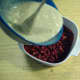 Pour flour mixture over raspberries