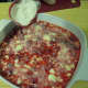 Add flour/sugar mixture to top of raspberries to form the crust