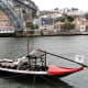 Flat bottomed boat near Ponte de Dom Luis 1, Porto.