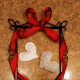 Secure fabric hearts to the frame with floss or twine.