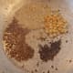 In a pan, heat 1-2 tablespoons of oil. Splutter 1/2 teaspoon of mustard seeds and 1 teaspoon of cumin seeds. Add 1 tablespoon of split black gram (urad dal) and Bengal gram.