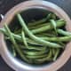 Wash and trim the French beans. Remove the fibrous strings if any.