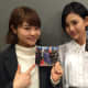 Chihiro Anai and Haruka Kodama hold up copies of the CD single for the song called Shekarashika. 