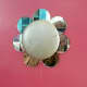 Close-up Detail of Dresser Drawer Knob - Round mirror pieces are added around knob for floral effect.