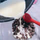 Pour the mixture over the chocolate chips, letting it sit for just a few seconds.