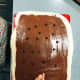 Sprinkle the chocolate chips on the Nutella-coated dough.