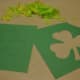 Cutting out the shamrocks.