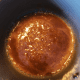 Combine corn syrup and brown sugar in a saucepan. Cook over medium heat, stirring frequently, until the mixture bubbles.