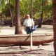 Old Hawaiian canoe & my hubby at Place of Refuge on Big Island of Hawaii