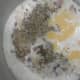 When onion turn pink, add milk, oregano, black pepper powder, salt and cheese slices