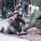 Marine sniper team searching for targets in Hue February 1968. Note in the background soldier with a bayonet on his M-16.   