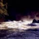The Merced River illuminated at night. View from our patio.