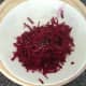 Grated beetroot is seasoned