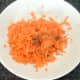 Grated carrot is seasoned