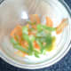 White wine vinegar is added to shaved white turnip, apple and carrot