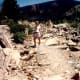 My niece walking amidst the rubble that used to be on top of a mountain in the far distance - Gros Ventre Slide