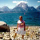 My mother, with Jackson Lake and the Tetons forming the backdrop, at the Signal Mountain boat ramp area