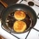 Shallow frying the fish cakes