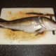 A deep eliptical cut is made behind the codling's pectoral (head) fin