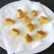 Croutons are drained and cooled on kitchen paper
