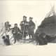Sami People in the late 1800s, in front of their home.