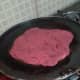 8. Heat a skillet (tawa or fry pan) over medium heat. Roast the paratha on one side for some time.
