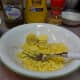 Mash the cooked yolks with a fork.